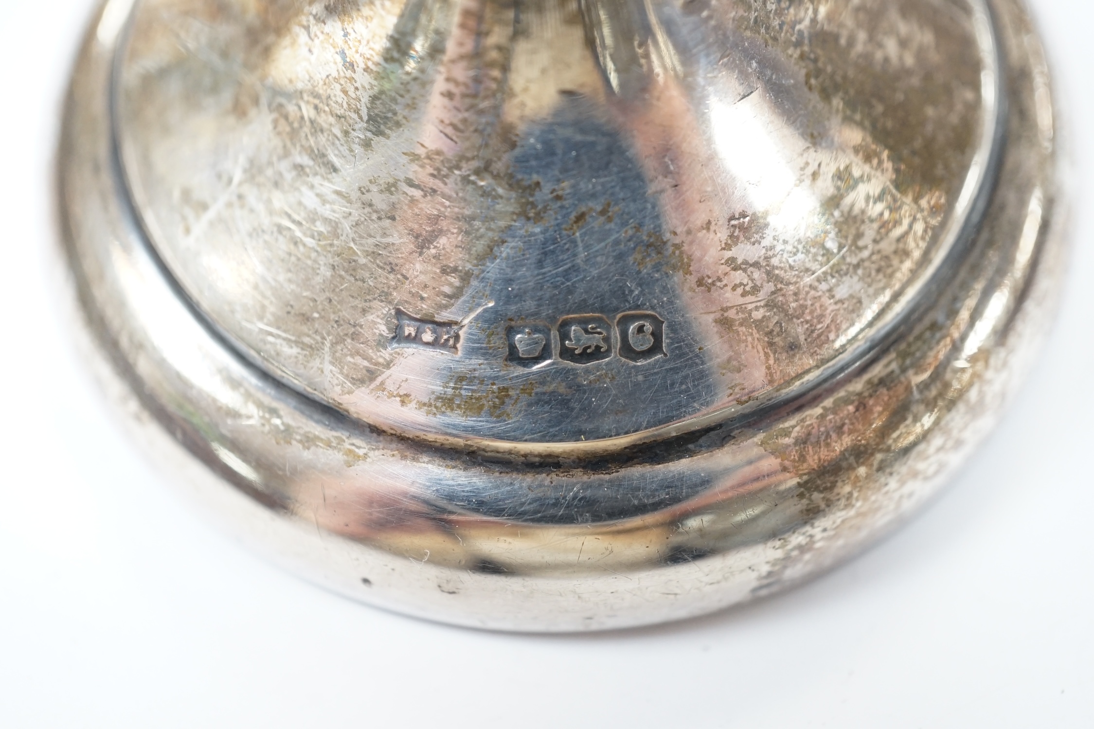 A pair of 1940's silver trumpet vases, 19.7cm, weighted, and a George V silver mounted photograph frame. Condition - poor